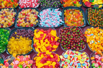 sweets marmalade and chewable candies on the counter at candy store in oriental market