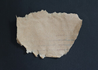 torn ripped paper on black background.