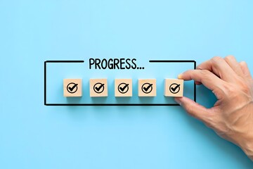 Checklist and task progress tracking concept. A hand placing the final checkmark on wooden blocks in a progress bar, task completion, productivity, goal setting, and efficient project management.