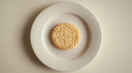 Round Rice Cracker on a White Plate