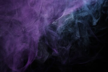Beautiful smoke in neon lights on dark background