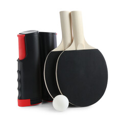 Ping pong rackets, ball and net isolated on white