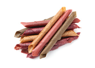Delicious fruit leather rolls on white background, top view