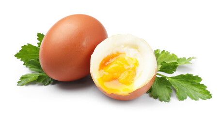 Soft boiled eggs and parsley on white background
