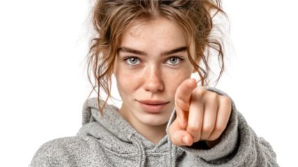 Confidence in Focus: A close-up portrait of a young woman with radiant freckles, confidently pointing towards the viewer. Her gaze is filled with self-assurance. 