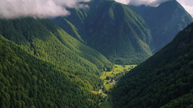 Majestic valley panorama with rolling clouds and lush forests