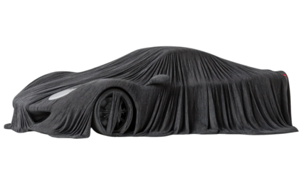 A sleek, dark-grey sports car, partially visible under a heavy, draped cloth, suggesting mystery or anticipation