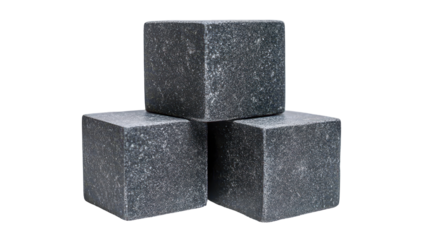 Three dark gray, speckled, cubic stones stacked;  smooth, polished surfaces;  suggesting weight and coolness
