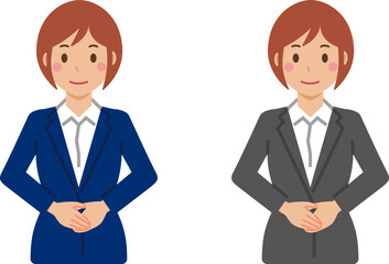 手を前で重ねて立つショートヘアの若い女性。スーツ姿の上半身