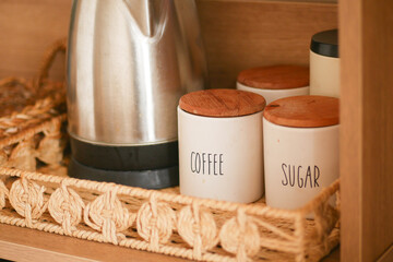 Coffee and sugar jars on a cozy kitchen shelf