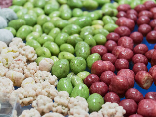 Delightful assortment of colorful dragee candies displayed in a bright candy shop, inviting sweet cravings and joyful memories