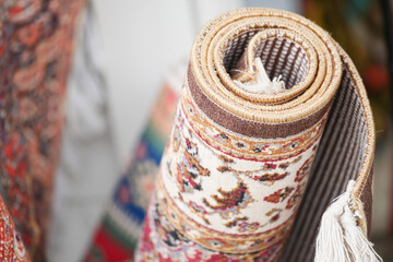 Beautifully rolled decorative rug for sale in a market