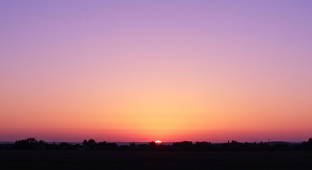 Fiery Sunrise: Red and Orange Horizon Glow