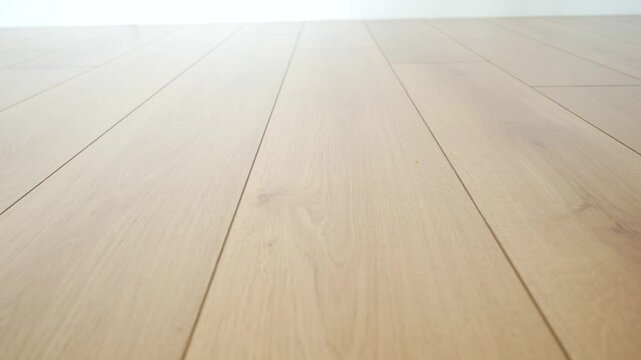 Wooden floor installation in a bright room