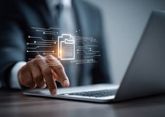 Close-up of a person's hand interacting with a laptop, showcasing a digital document icon and circuit board design, symbolizing data processing and digital document management