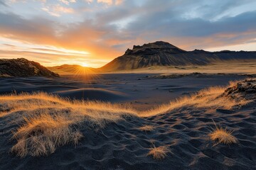 Fototapeta premium sunset over textured orange and black sand dunes