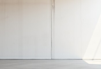 Empty room with light beige walls and light gray floor.