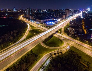 Fototapeta premium Aerial Night View of Illuminated Highway Interchange in City