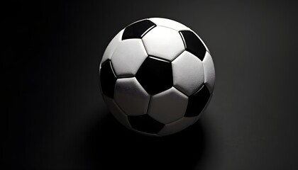 Fototapeta premium White and Black Soccer Ball in Dark Background