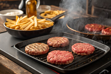 Juicy Beef Burgers and Crispy French Fries Cooking