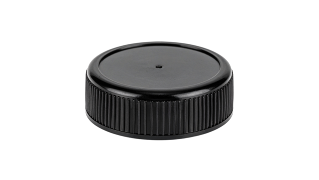 A closeup of a black camera lens with a silver ring, resembling a hockey puck, isolated on a white background