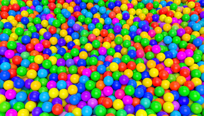 Colorful ball pit filled with vibrant red, blue, green, yellow, orange, and purple plastic balls creating playful and joyful atmosphere in fun environment