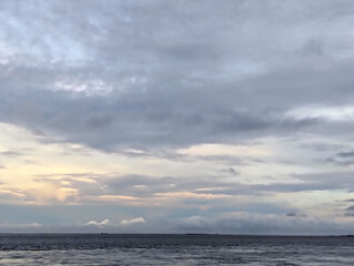 Cloudy sky and riverside view, The sky is cloudy and the ocean is calm