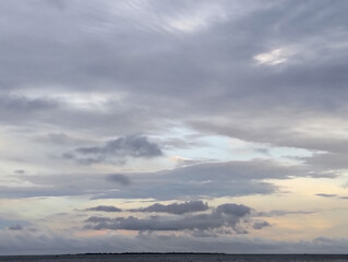 Cloudy sky and riverside view, The sky is cloudy and the ocean is calm
