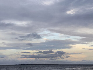 Cloudy sky and riverside view, The sky is cloudy and the ocean is calm
