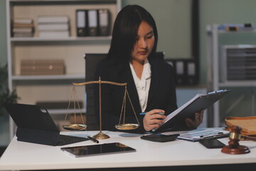 Judge gavel with Justice lawyers having team meeting at law firm background. Concepts of Law and...