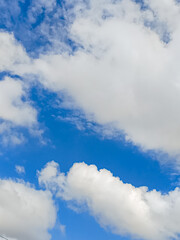 Obraz premium Cumulus clouds in the sky are abstract and aesthetic, with a blue sky background. Cumulus clouds are white clouds that have a flat base that look very soft and fluffy