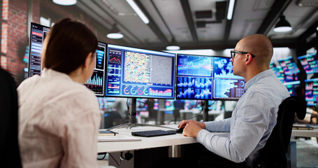 Man And Woman Analyzing Financial Data