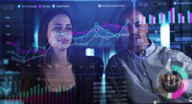 Man Analyzing Financial Data On Holographic Dashboard