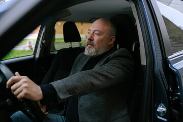 Elderly Man Driving a Car with Calm Expression