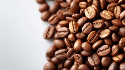 Fototapeta premium Pile of coffee beans on a white background