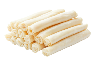 A close-up shot of a stack of pale, rolled dough sheets, neatly arranged against a black background.  The dough appears smooth and uniformly colored