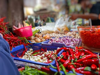 Colorful chili peppers and spices at a traditional market—ideal for culinary, food industry, or spicy cuisine themes. Vibrant and flavorful ingredients from Southeast Asia