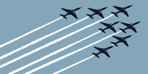 Formation of jet aerobatic airplanes silhouetted against a light blue background
