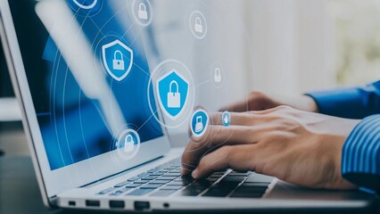 A hand is typing on a laptop, with various security-related icons displayed around the with a transparent digital screen