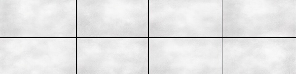 Six white square tiles arranged in a 2x3 grid with thin black grout lines