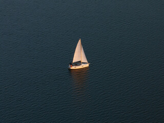 Aerial View of Sailboat on Calm Water