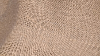 Close-up of fabric woven from burlap. sackcloth bagging textured background closeup