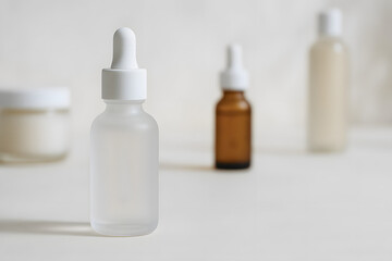 Plastic medicine bottles with syringes and pills are isolated on white