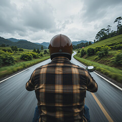 Riding Motorcycle on Scenic Country Road with Hills and Cloudy Sky