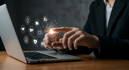Man using laptop with digital interface and icons displaying on the screen in a modern office setting