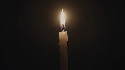 Single candle in the dark.