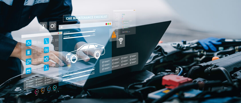 Car service and checking concept. Hand of a mechanic with laptop for maintenance checklist vehicle, Software for manager check to repair, technology checkup automotive. Customer service concept