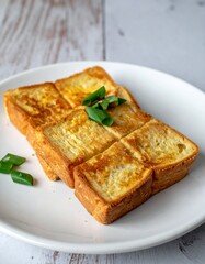 Delicious French Toast with Green Onion Garnish on White Plate