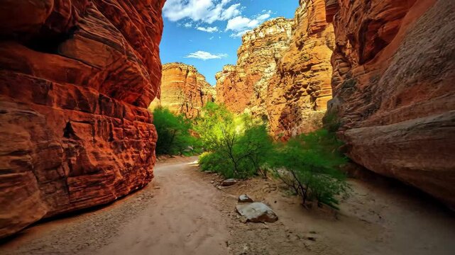 Stunning slot canyon reveals vibrant rock formations and lush greenery under a bright blue sky, beautiful scenery slot canyon of nature video ing for live wallpaper