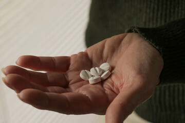 Hand with medical pills. Health care medicine subscription, illness, depression, addiction,...
